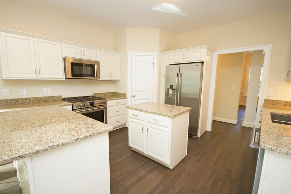 Large transitional u-shaped dark wood floor eat-in kitchen photo in Richmond with a double-bowl sink, raised-panel cabinets, white cabinets, granite countertops, beige backsplash, stainless steel appliances and an island