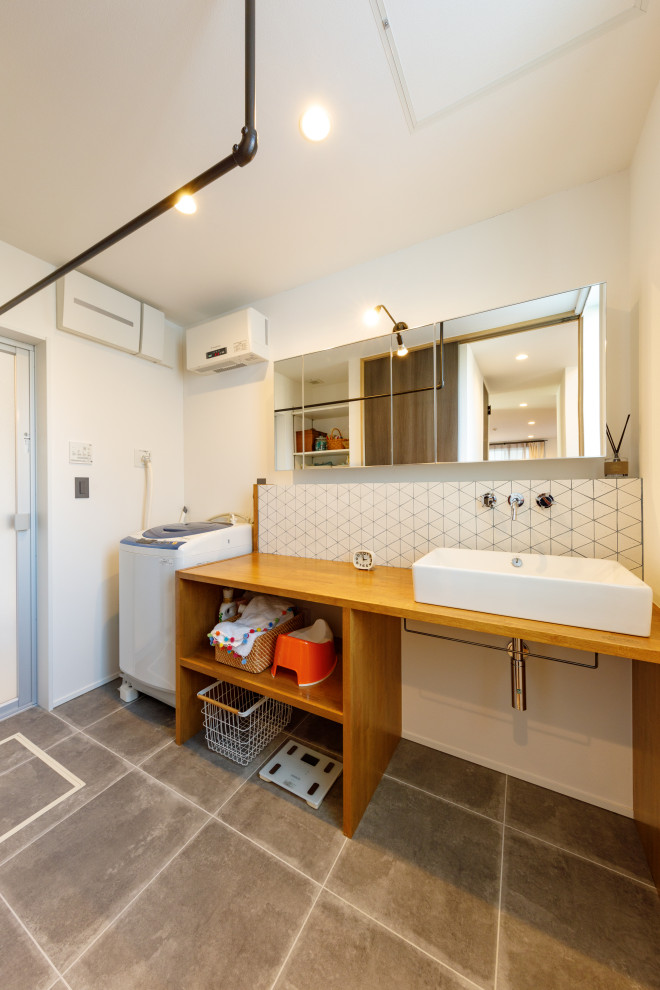Design ideas for an asian laundry room in Tokyo Suburbs with grey floor and white walls.