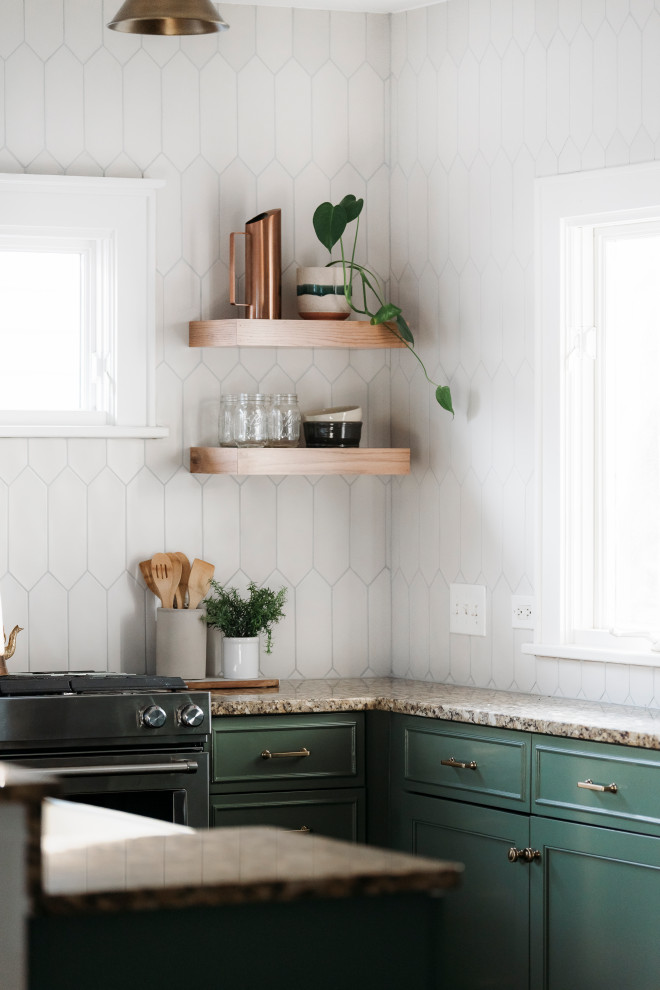 Example of a mid-sized transitional l-shaped dark wood floor and brown floor open concept kitchen design in Chicago with a farmhouse sink, recessed-panel cabinets, green cabinets, granite countertops, white backsplash, ceramic backsplash, stainless steel appliances, a peninsula and beige countertops