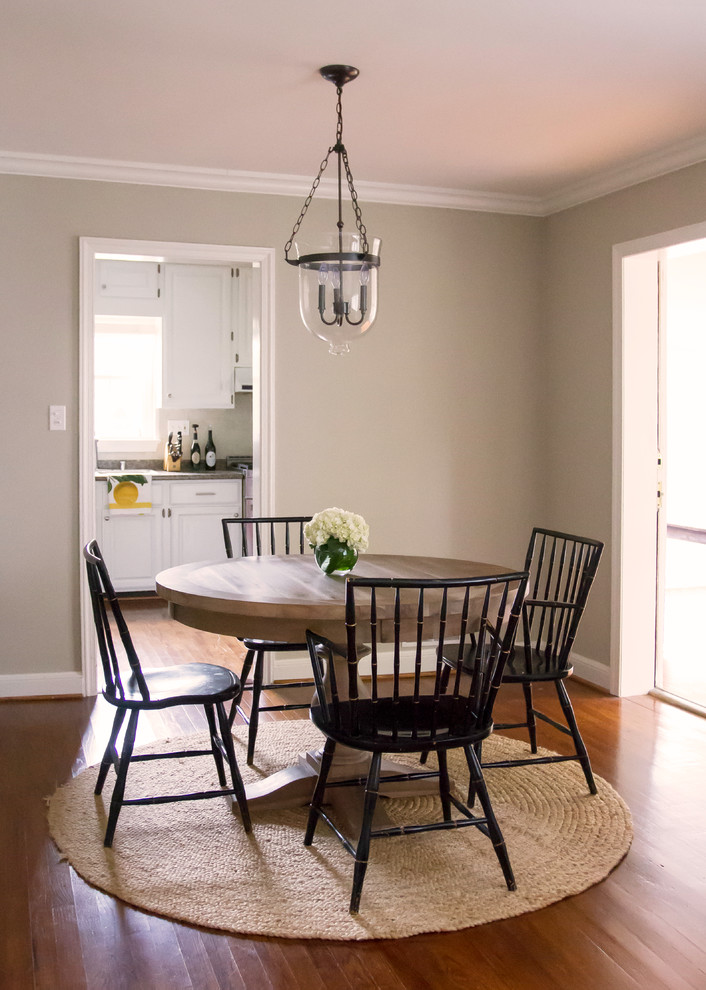 Small transitional separate dining room in DC Metro with grey walls, medium hardwood floors and no fireplace.