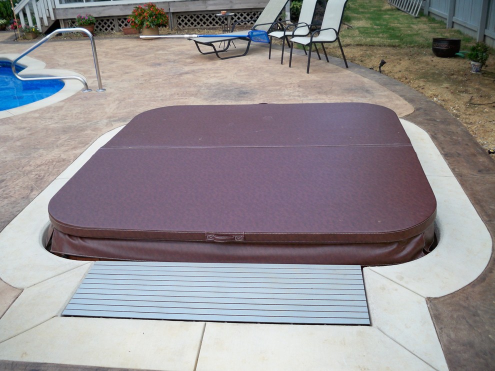 Hot tub - mid-sized transitional backyard stamped concrete and rectangular hot tub idea