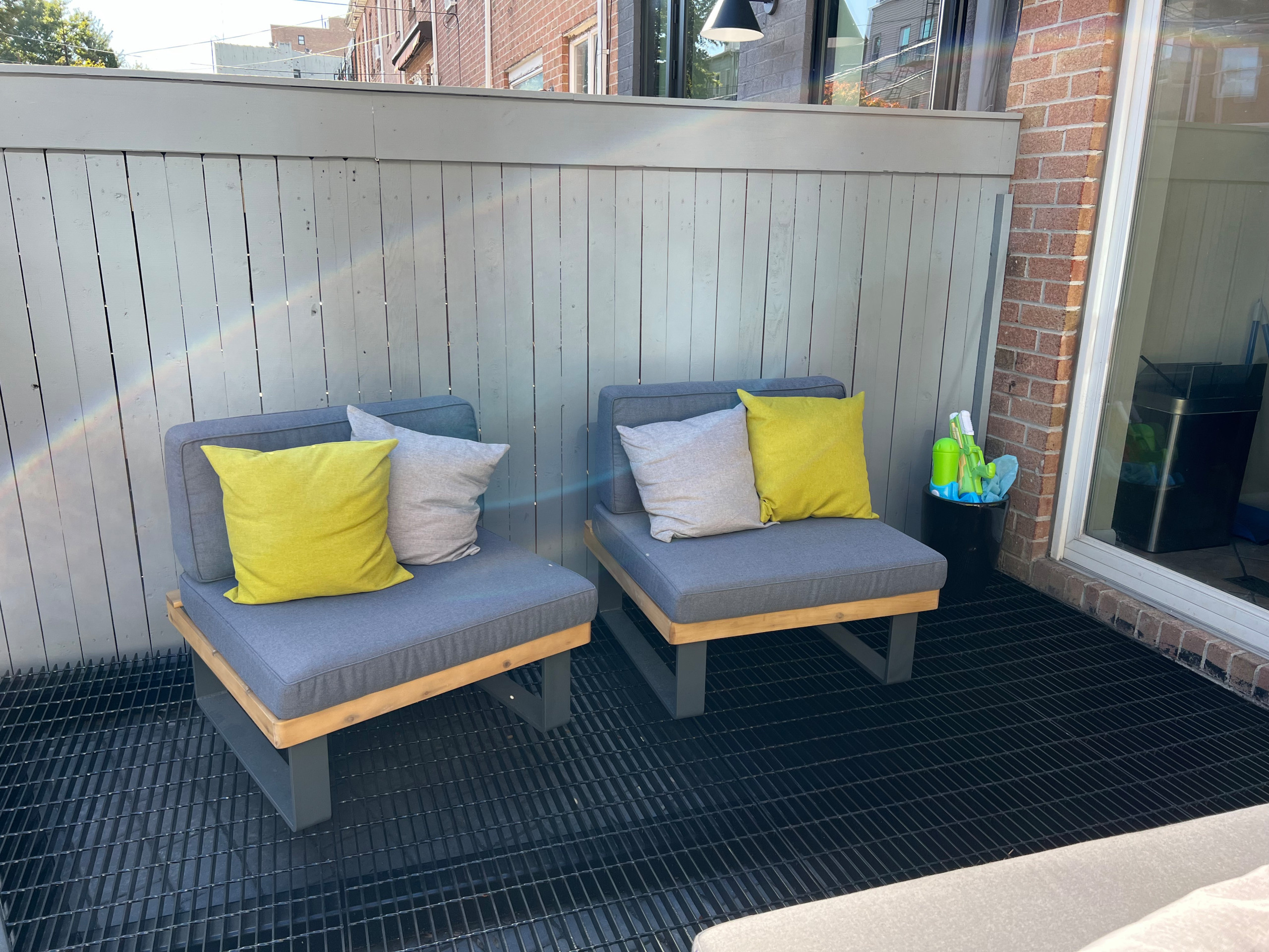 Paved patio with metal grating garden