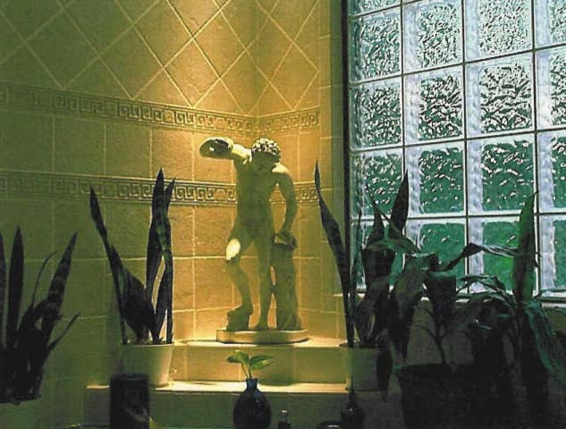 Large eclectic master beige tile and ceramic tile ceramic tile drop-in bathtub photo in Charlotte with raised-panel cabinets, white cabinets, a two-piece toilet, beige walls, a wall-mount sink and solid surface countertops