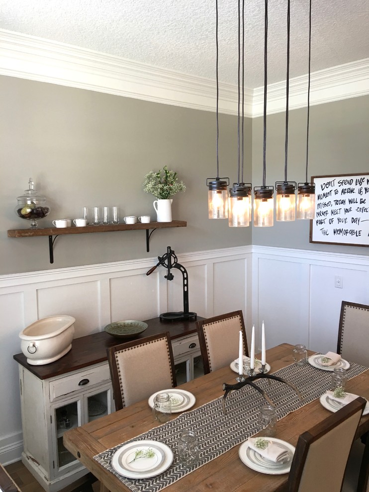 Inspiration for a mid-sized country separate dining room in Jacksonville with grey walls and medium hardwood floors.