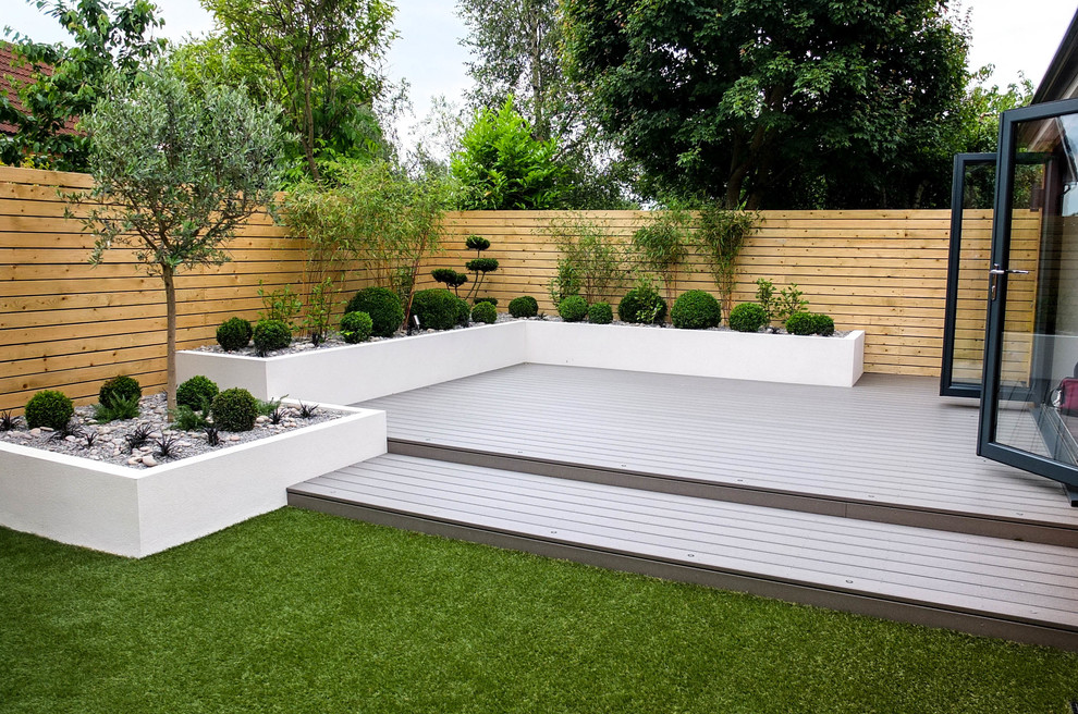 Small contemporary backyard shaded garden in Other with a container garden and decking for summer.