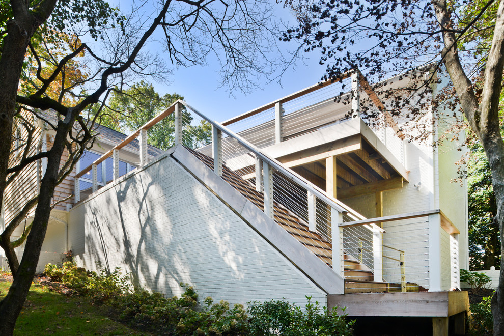 Huge minimalist side yard deck photo in DC Metro with no cover