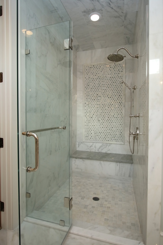 This is an example of a large traditional master bathroom in Houston with beaded inset cabinets, an alcove shower, marble floors, a drop-in sink, limestone benchtops and an undermount tub.