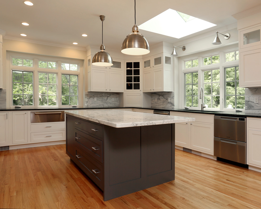 Design ideas for a transitional u-shaped eat-in kitchen in Boston with an undermount sink, shaker cabinets, white cabinets, granite benchtops, marble splashback, stainless steel appliances, medium hardwood floors and with island.