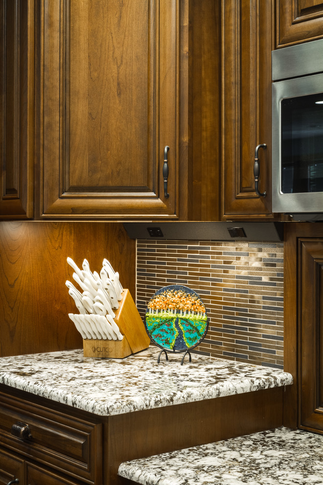 Inspiration for a large transitional l-shaped eat-in kitchen remodel with two islands