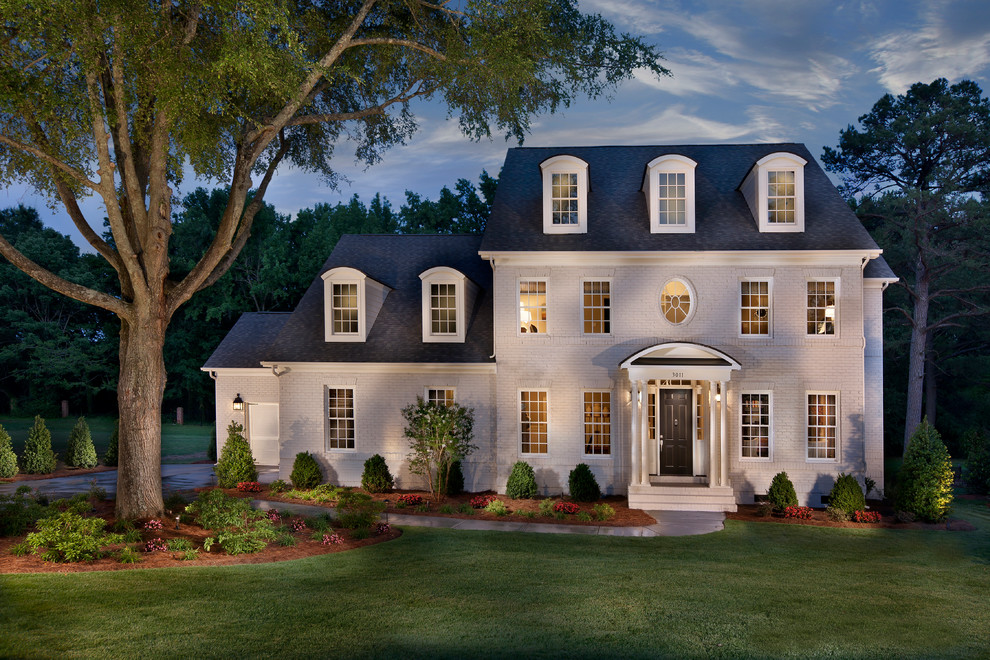 Inspiration for a large traditional three-storey brick white exterior in Charlotte.