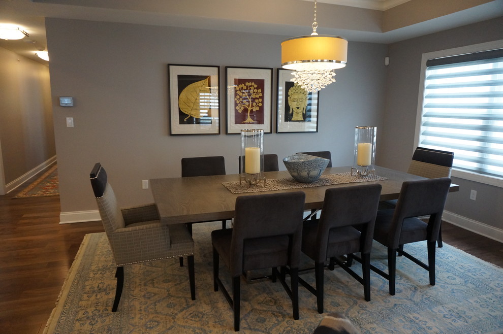 Enclosed dining room - mid-sized transitional dark wood floor and brown floor enclosed dining room idea with gray walls and no fireplace