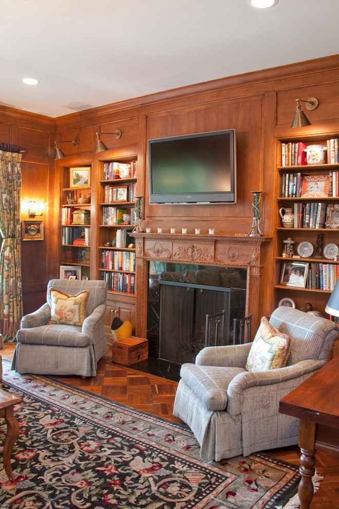 Photo of a traditional home office in Cincinnati with medium hardwood floors and a stone fireplace surround.