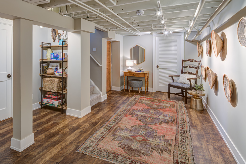 Photo of a mid-sized eclectic hallway in DC Metro with grey walls, vinyl floors and brown floor.