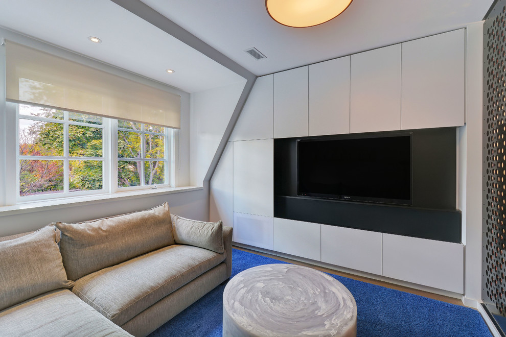 This is an example of a mid-sized modern enclosed family room in Toronto with white walls, dark hardwood floors and a built-in media wall.