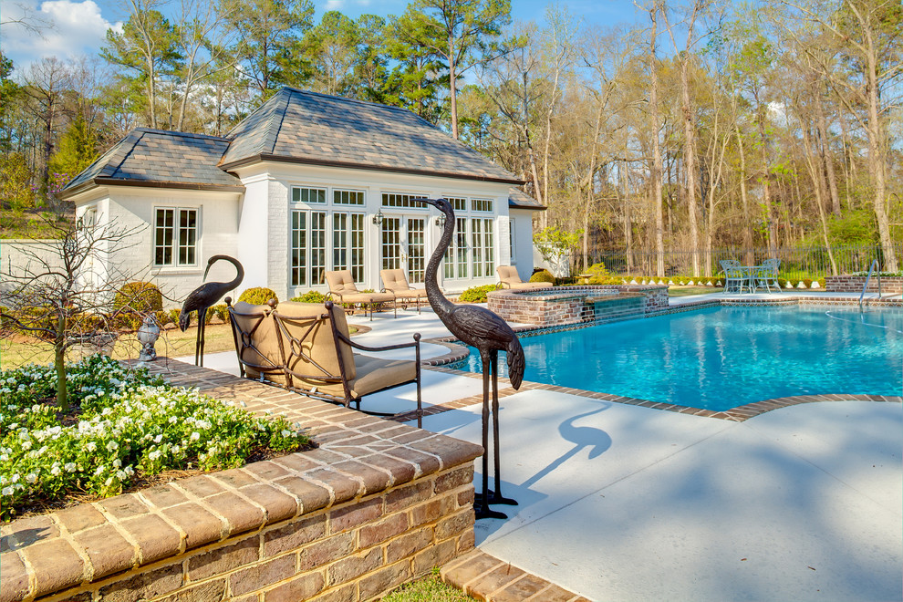 Design ideas for a mid-sized traditional backyard rectangular lap pool in Atlanta with a hot tub and concrete slab.