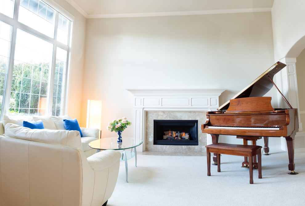 Inspiration for a large traditional open concept living room in Los Angeles with a music area, white walls, carpet, a standard fireplace, a wood fireplace surround and white floor.