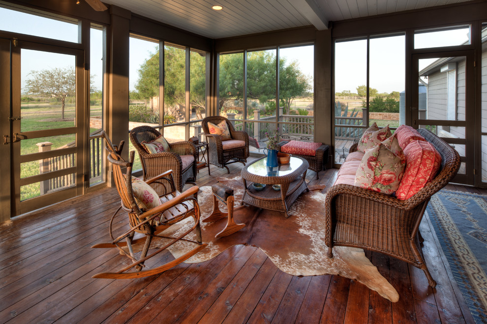 This is an example of a traditional verandah in Austin with decking and a roof extension.