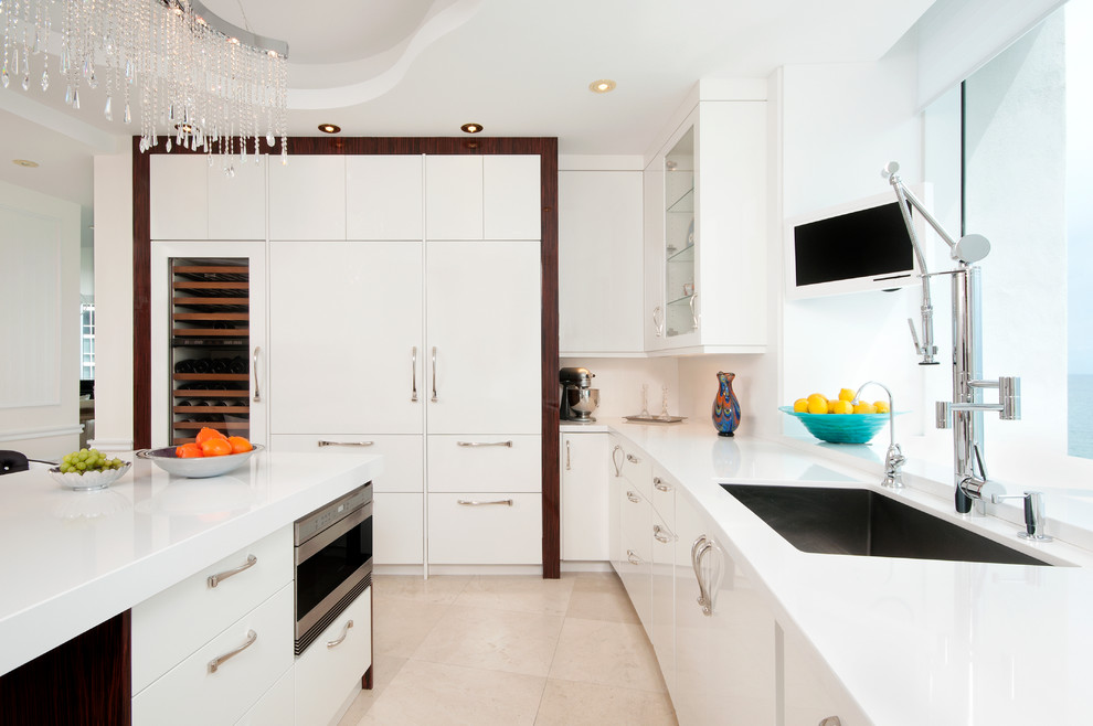Design ideas for a large modern u-shaped separate kitchen in Miami with an undermount sink, flat-panel cabinets, white cabinets, quartz benchtops, white splashback, with island, stainless steel appliances and marble floors.