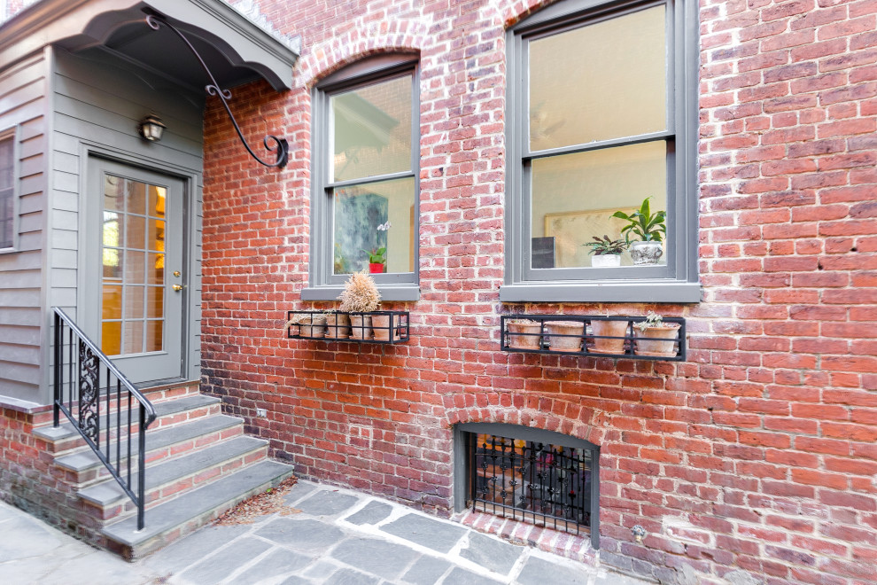 This is an example of a small traditional brick exterior in Richmond.
