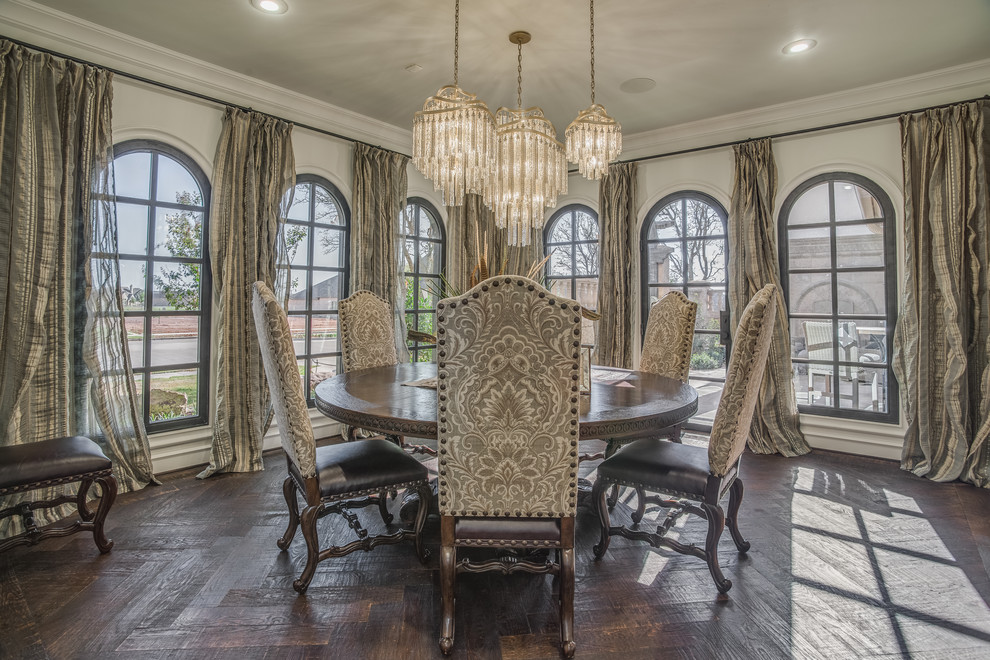 Photo of a large traditional separate dining room in Austin with dark hardwood floors and beige walls.