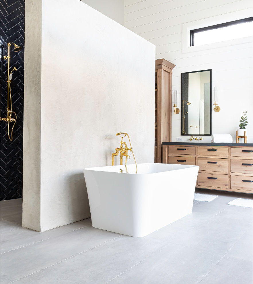 Example of a large country master blue tile and ceramic tile porcelain tile, gray floor and double-sink bathroom design in San Francisco with flat-panel cabinets, light wood cabinets, white walls, an undermount sink, granite countertops, black countertops and a freestanding vanity