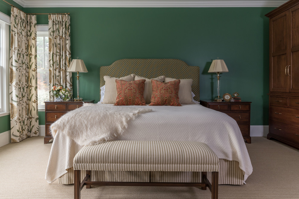 This is an example of a traditional bedroom in Boston with green walls, carpet and beige floor.