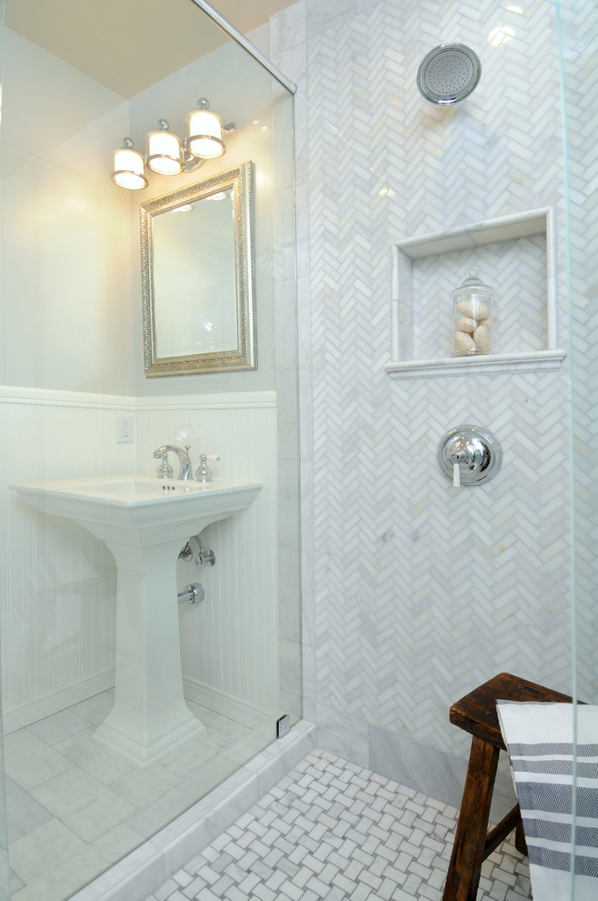 Elegant stone tile bathroom photo in Los Angeles with a pedestal sink