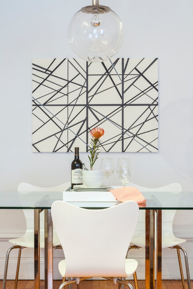 Design ideas for a large contemporary separate dining room in New York with white walls and medium hardwood floors.