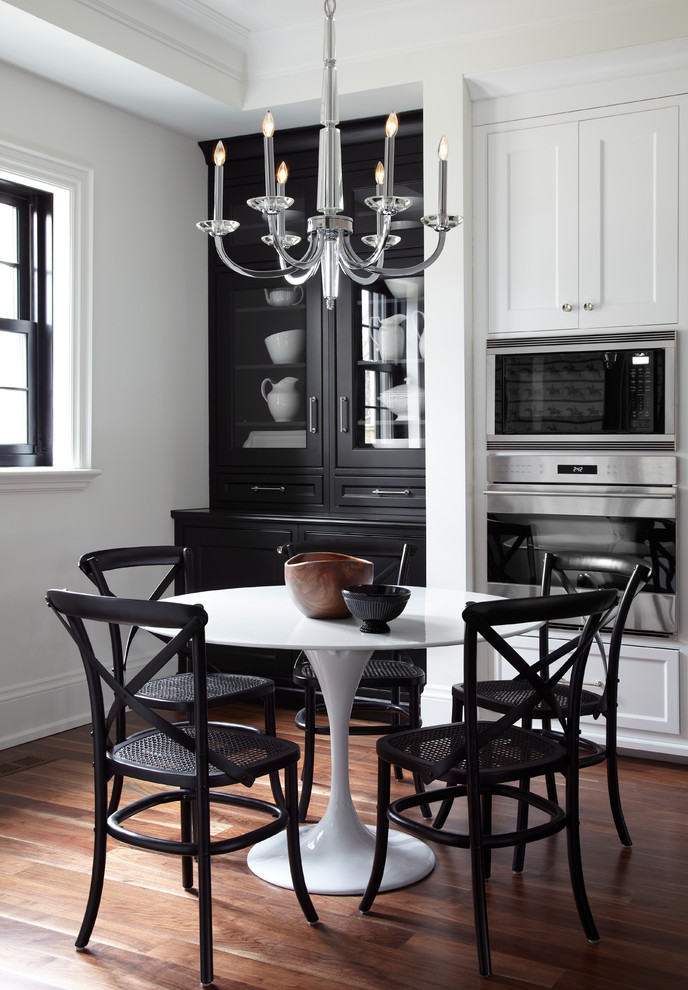 Transitional kitchen/dining combo in Toronto with dark hardwood floors.