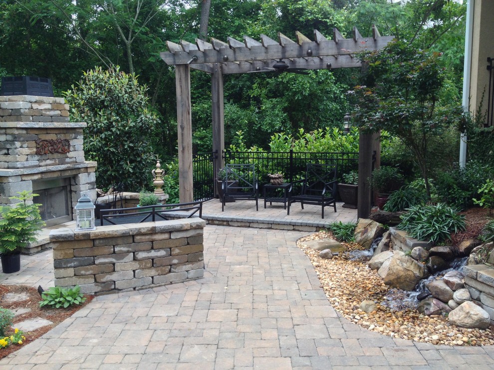 Traditional patio in Atlanta with a fire feature and a gazebo/cabana.