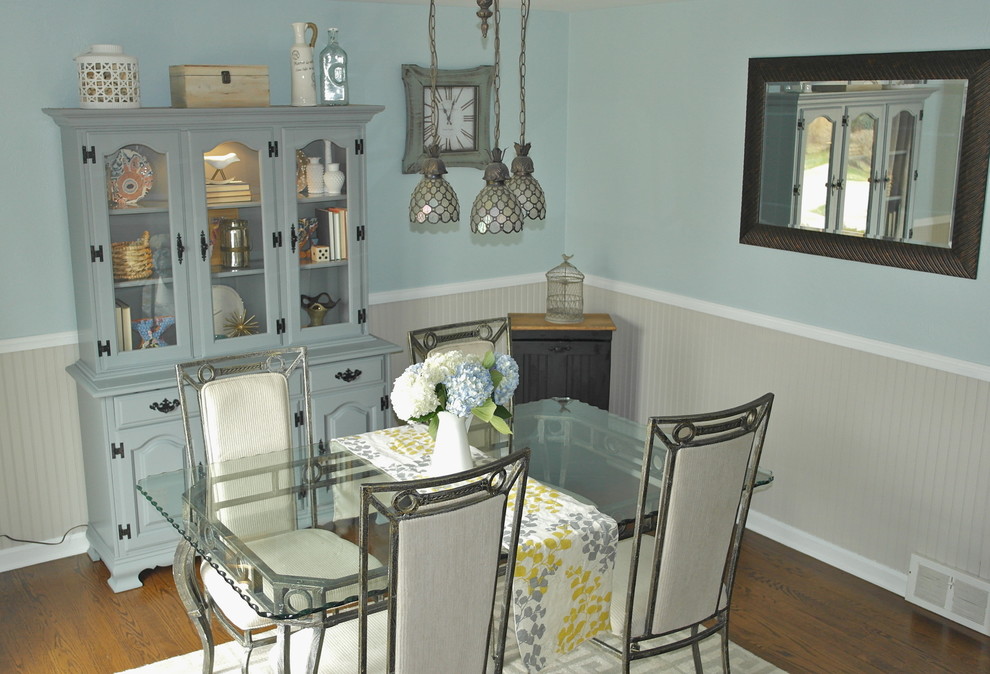 Enclosed dining room - mid-sized transitional medium tone wood floor and brown floor enclosed dining room idea with blue walls and no fireplace