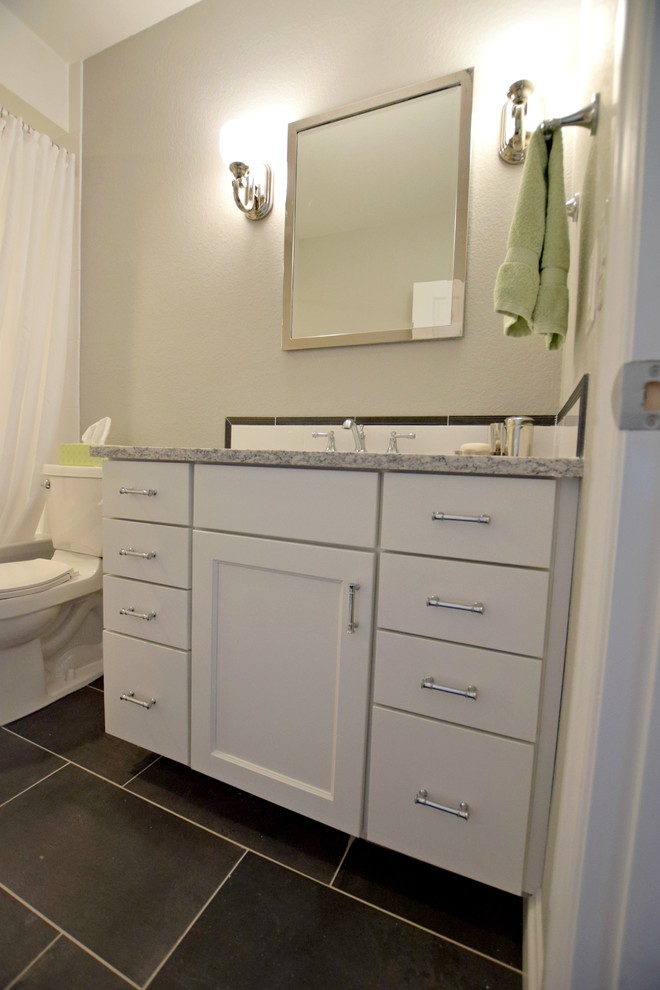 Inspiration for a small transitional bathroom in Denver with recessed-panel cabinets and white cabinets.