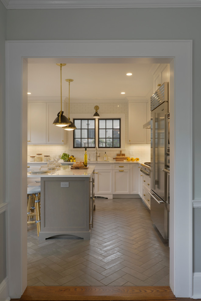 Enclosed kitchen - small transitional u-shaped porcelain tile and gray floor enclosed kitchen idea in New York with an undermount sink, recessed-panel cabinets, gray cabinets, quartz countertops, white backsplash, ceramic backsplash, stainless steel appliances, an island and white countertops