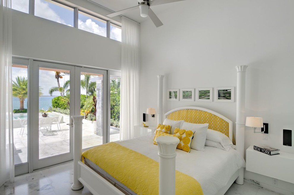 Inspiration for a contemporary bedroom in Miami with white walls, no fireplace and marble floors.