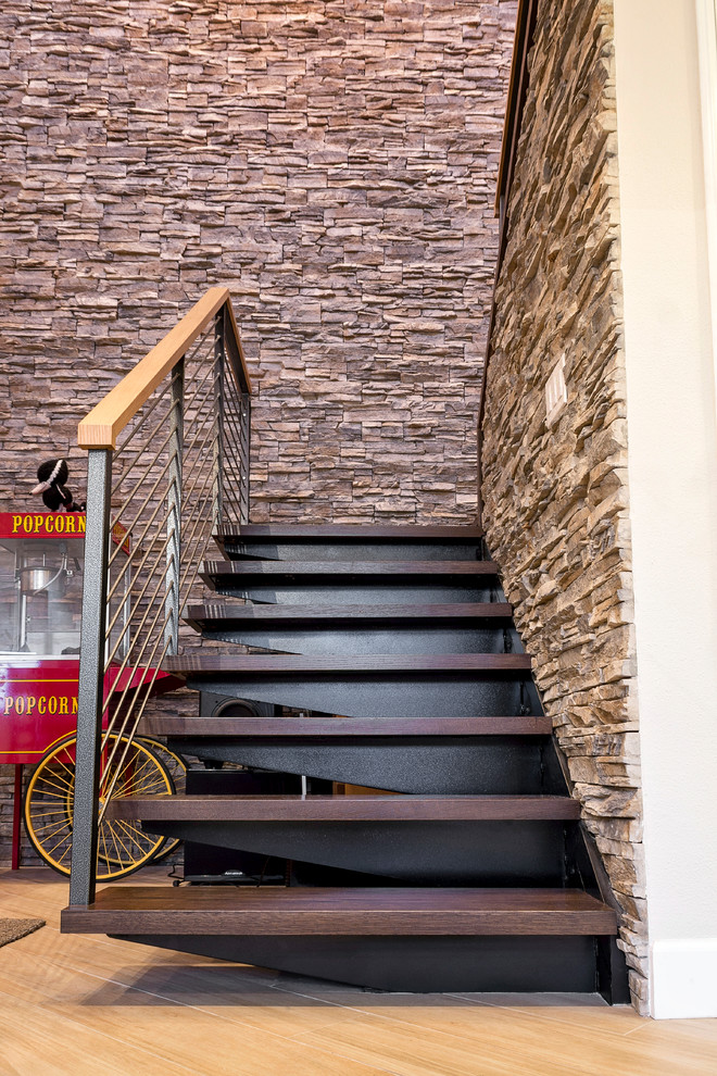 Photo of a mid-sized contemporary wood u-shaped staircase in Orange County with metal risers.