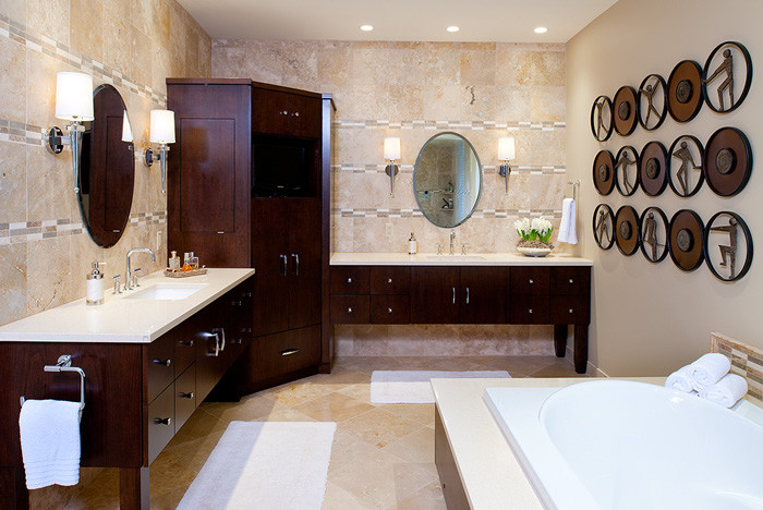 Design ideas for a large contemporary master bathroom in Other with flat-panel cabinets, dark wood cabinets, a drop-in tub, brown tile, beige walls, travertine floors, an undermount sink, engineered quartz benchtops, beige floor and beige benchtops.
