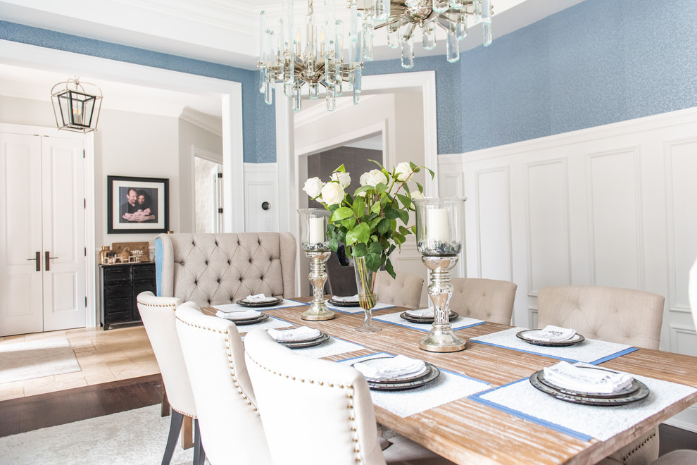 Inspiration for a large transitional separate dining room in Toronto with blue walls, medium hardwood floors, no fireplace and brown floor.