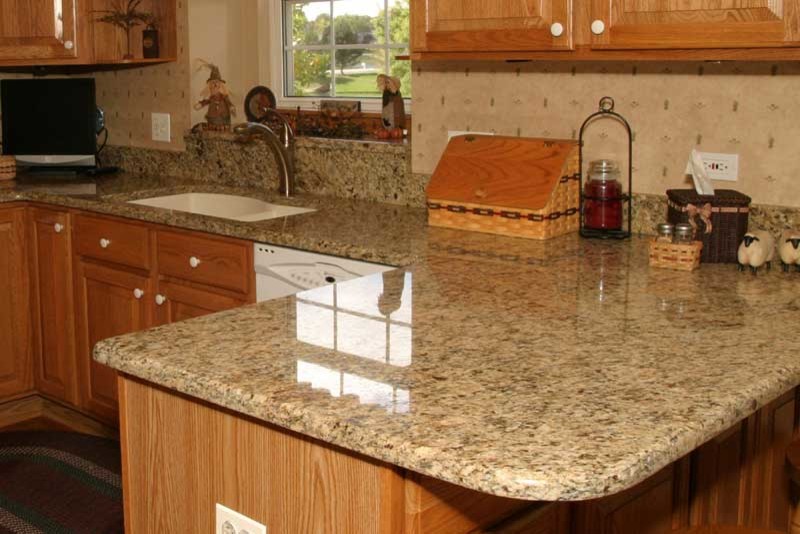 Inspiration for a transitional u-shaped medium tone wood floor kitchen pantry remodel in Chicago with raised-panel cabinets, medium tone wood cabinets and granite countertops