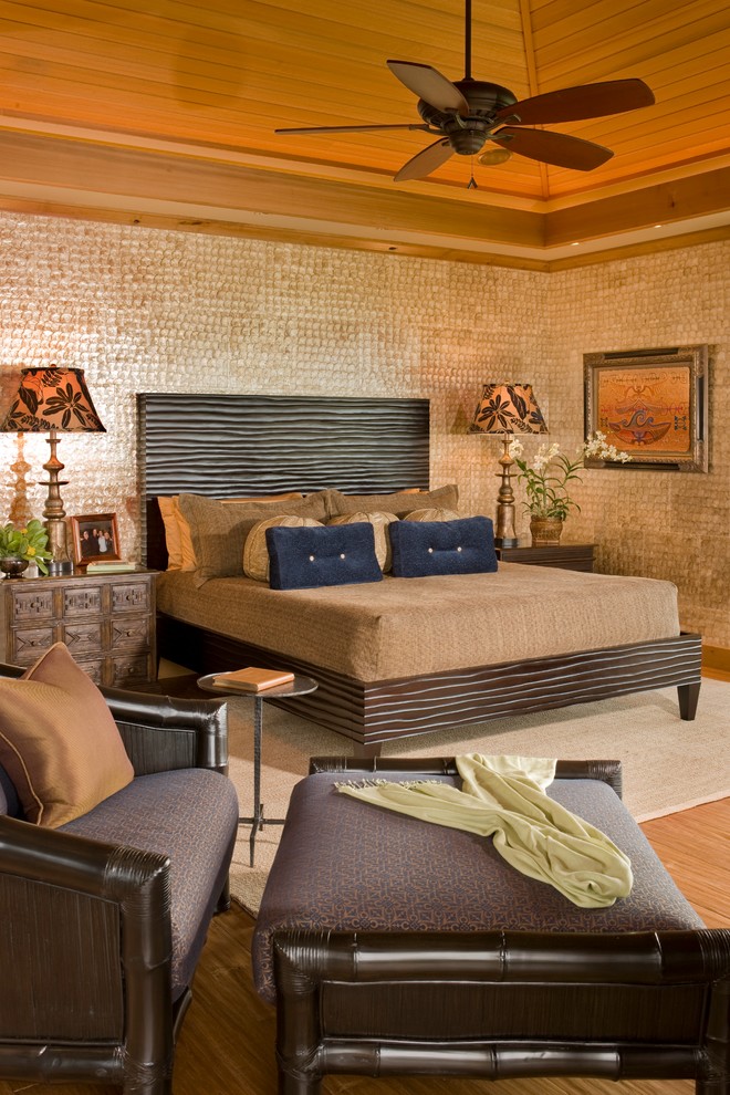 Photo of a tropical master bedroom in Hawaii with brown walls.