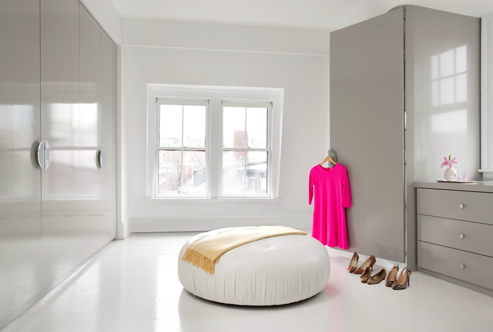 This is an example of a modern women's dressing room in Boston with flat-panel cabinets and grey cabinets.