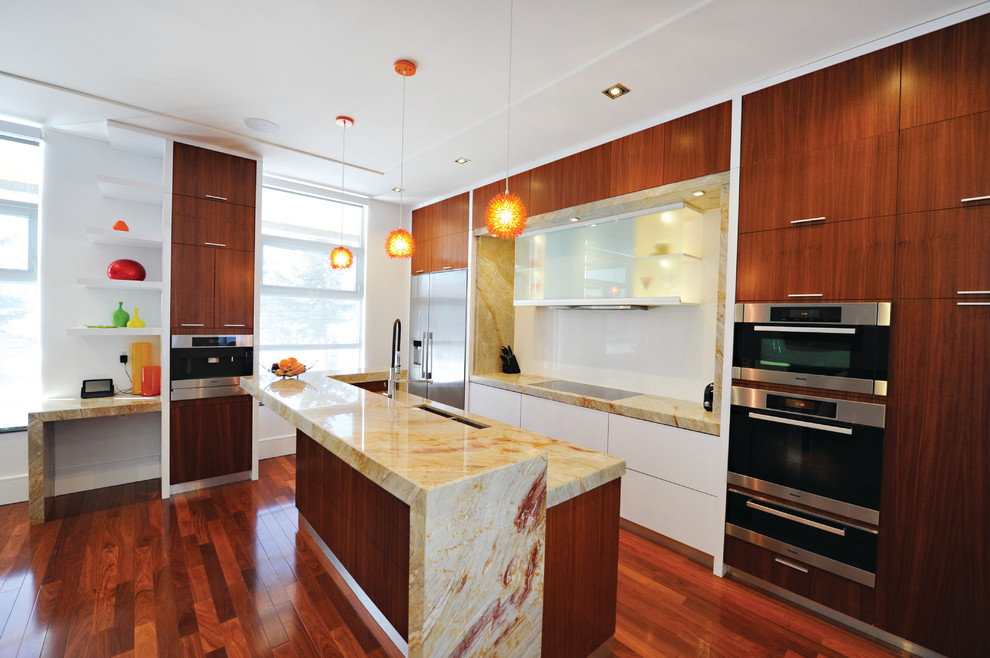 Mid-sized transitional single-wall medium tone wood floor eat-in kitchen photo in Toronto with a double-bowl sink, flat-panel cabinets, medium tone wood cabinets, granite countertops, multicolored backsplash, stone slab backsplash, stainless steel appliances and an island
