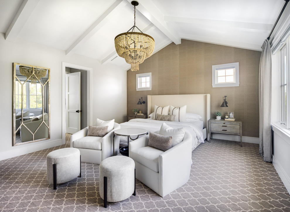 Photo of a large transitional master bedroom in Orange County with grey walls, vaulted, wallpaper, carpet, a standard fireplace, a wood fireplace surround and grey floor.