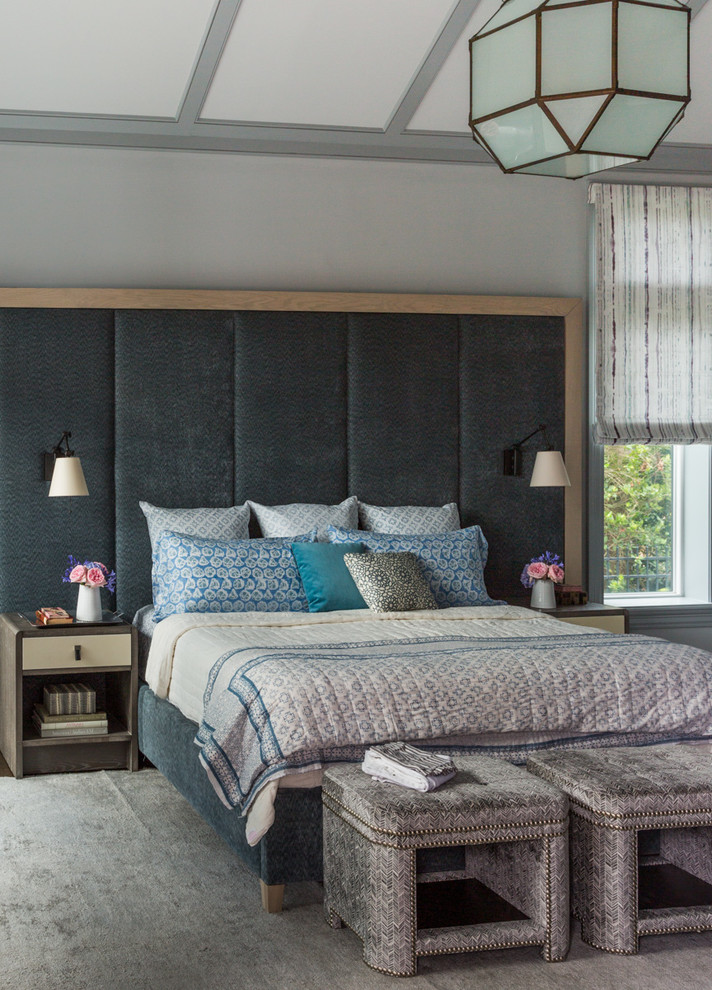 This is an example of a contemporary master bedroom in Jacksonville with grey walls and carpet.