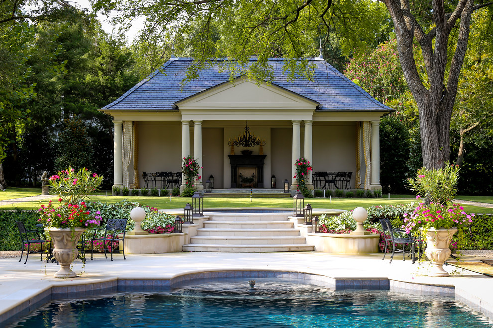 This is an example of a traditional custom-shaped pool in Dallas with a pool house.
