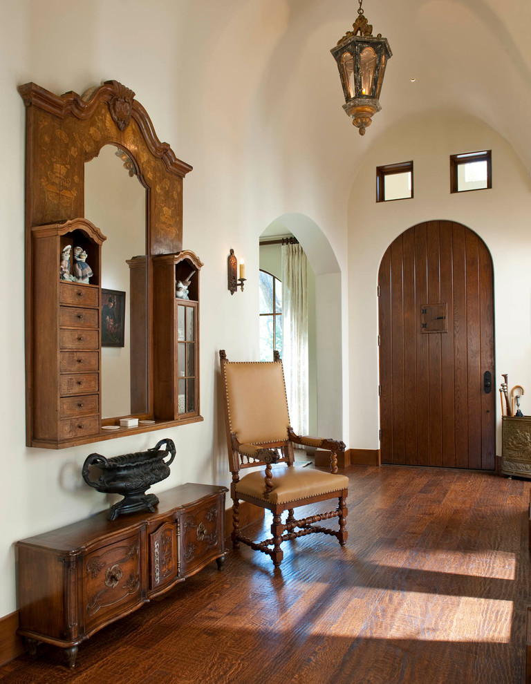 Design ideas for a mediterranean foyer in San Diego with medium hardwood floors and a single front door.