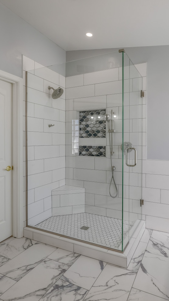 Inspiration for a large modern ensuite bathroom in Phoenix with shaker cabinets, blue cabinets, a corner shower, white tiles, ceramic tiles, grey walls, porcelain flooring, a submerged sink, engineered stone worktops, white floors, a hinged door, white worktops, a wall niche, double sinks and a built in vanity unit.