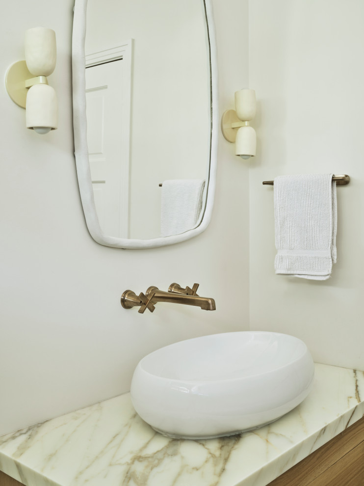 Spanish Modern - Small transitional single-sink bathroom photo in Los Angeles with light wood cabinets and a vessel sink