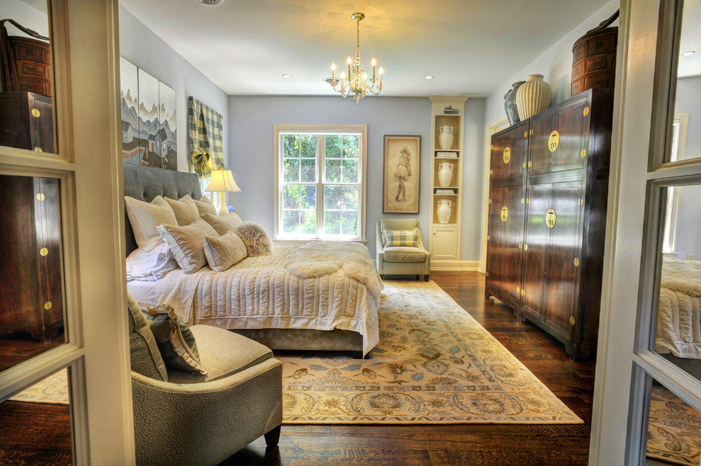 Design ideas for a traditional bedroom in Other with grey walls, dark hardwood floors and no fireplace.