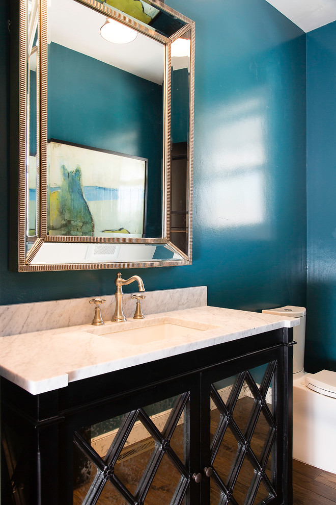 Design ideas for a transitional powder room in Milwaukee with white benchtops.