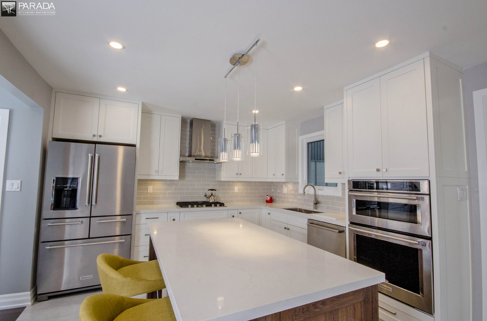 Example of a transitional kitchen design in Toronto